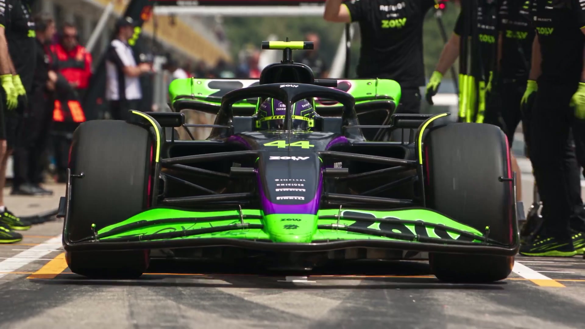 A ZOLV-liveried race car in the pit lane